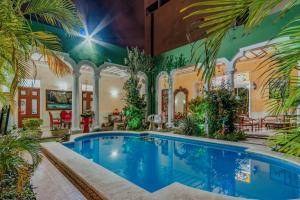 Bazén v ubytování Hotel Santa María Mérida nebo v jeho okolí