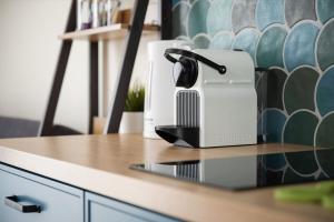 a black and white toaster sitting on a counter at APARTAMENTY ZATOKA in Jastarnia