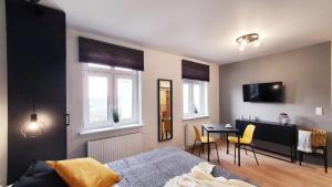 Telewizja i/lub zestaw kina domowego w obiekcie GRYF Apartamenty Holiday Family