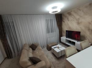 TV a/nebo společenská místnost v ubytování Apartman Stamenković