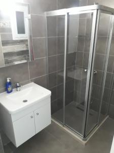 a bathroom with a shower and a sink at Ardem 5 Girne Luxury 1+1 in Kérynia +16 photos
