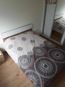 a bedroom with a bed with a mirror at Ardem 5 Girne Luxury 1+1 in Kérynia