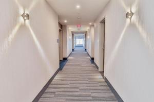 a hallway of an office building with a long corridor at Holiday Inn Express & Suites - Nashville MetroCenter Downtown, an IHG Hotel in Nashville