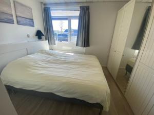 Ένα ή περισσότερα κρεβάτια σε δωμάτιο στο Appartement Walvis nr. 9D