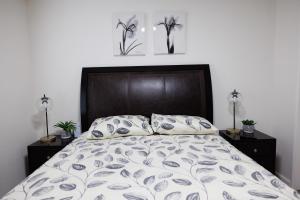 a bedroom with a large bed with two night stands at Elegant place near Santana Row for vacation/work in San Jose