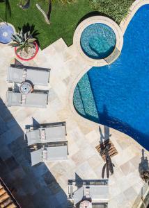 an overhead view of a swimming pool in a resort at Cliffside Luxury Inn in Búzios