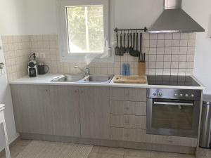 A kitchen or kitchenette at Villa in Loutra with Sea View and Pool
