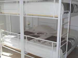 A bed or beds in a room at Villa in Loutra with Sea View and Pool
