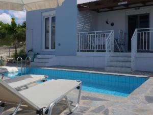 The swimming pool at or close to Villa in Loutra with Sea View and Pool