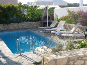 The swimming pool at or close to Villa in Loutra with Sea View and Pool