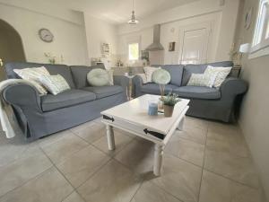 A seating area at Villa in Loutra with Sea View and Pool