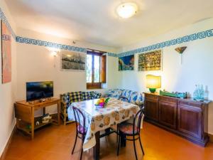 a dining room with a table and chairs at Gorgeous Villa in Ricadi with Shared Garden in Ricadi