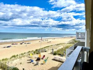 a view of the beach from the balcony of a beach house at Oceanfront Penthouse with Family & Friends in Salisbury