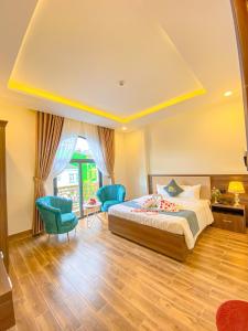 Voodi või voodid majutusasutuse Crown Dalat Hotel toas