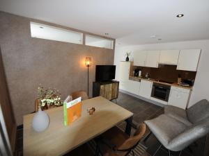 a kitchen and dining room with a table and chairs at Apartment in Untertauern near ski area in Untertauern