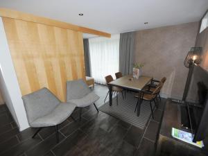 a living room with a dining room table and chairs at Apartment in Untertauern near ski area in Untertauern