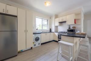 Kuchyň nebo kuchyňský kout v ubytování Lotus Stay Manly - Apartment 29F