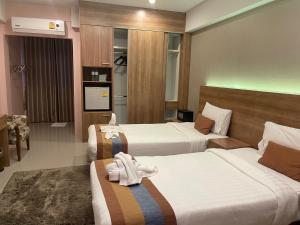 Postel nebo postele na pokoji v ubytování Unity Hotel