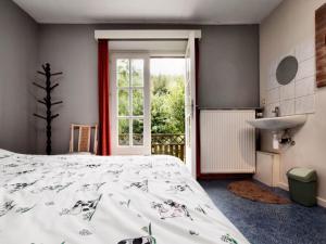 Letto o letti in una camera di Holiday Home in Rendeux near Nature Trails