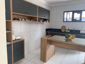 A cozinha ou kitchenette de Rio Claro Comfort Hostel e Suítes