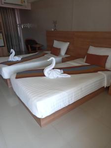 Postel nebo postele na pokoji v ubytování Unity Hotel