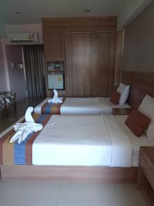 Postel nebo postele na pokoji v ubytování Unity Hotel