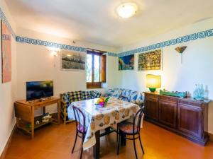 a dining room with a table and chairs at Spacious Villa in Calabria with Swimming Pool in Ricadi