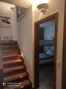 a stairway leading to a bedroom with a bunk bed at DEPAR DE PLAYA Casa Blanca Same in Same +4 photos