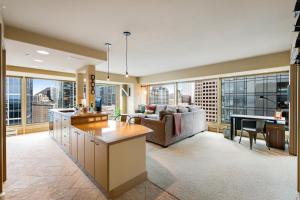 a kitchen and living room with a couch and a table at Newmark Tower II in Seattle