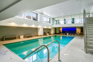 a large pool with blue water in a building at Newmark Tower II in Seattle
