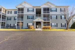 a large apartment building with a street in front of it at Villas at Bay Crossing - 34670 Villa Circle Unit #2304 in Lewes