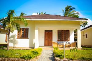 a small house with a porch at V-Szameitat Homes in Diani Beach