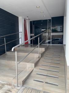 a set of metal stairs in a building at Locación Jujuy in San Salvador de Jujuy