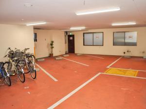a room with a bunch of bikes parked in it at Kochi Sakura Hotel in Kochi