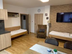 Postel nebo postele na pokoji v ubytování Apartment Rezidence - Javor & Wellness + 37 fotografií