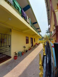 a building with a balcony and a water slide at VEERAS HOME STAY in Port Blair