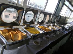 a row of trays of food on a bus at Hotel U.T.ELITE in Bangalore