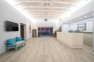 an office with a large room with a ceiling at Remetzo Village in Lixouri +56 photos