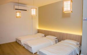 Postel nebo postele na pokoji v ubytování Rumah Tetamu Bunk Bunk