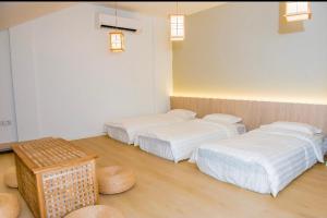 Postel nebo postele na pokoji v ubytování Rumah Tetamu Bunk Bunk