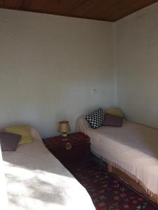 Ένα ή περισσότερα κρεβάτια σε δωμάτιο στο Maison chaleureuse climatisée à Maubuisson, proche lac