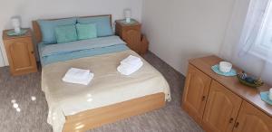 Postel nebo postele na pokoji v ubytování Rózsa apartman