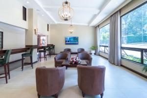 a waiting room at a hospital with chairs and a table at Heri Heights Serviced Apartments by Trianum in Nairobi