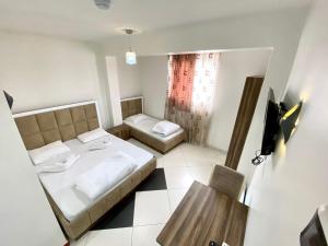 Postel nebo postele na pokoji v ubytování Hotel Heimli