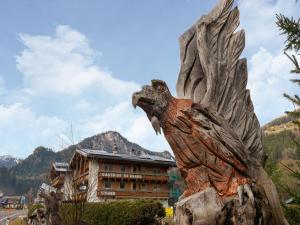 a statue of an eagle in front of a building at Apartment in Wald near Zillertal Ski Slopes in Wald im Pinzgau +32 photos