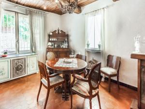 a dining room with a wooden table and chairs at Charming holiday home in Lorgues with pool in Lorgues