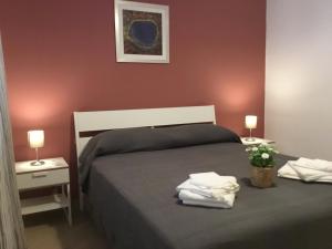 Postel nebo postele na pokoji v ubytování Appartamenti Rimembranze