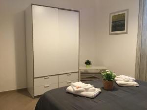 Postel nebo postele na pokoji v ubytování Appartamenti Rimembranze