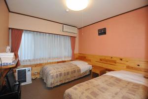 Katil atau katil-katil dalam bilik di Turtle Inn Nikko