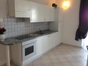 Kuchyň nebo kuchyňský kout v ubytování Residence Candeloro